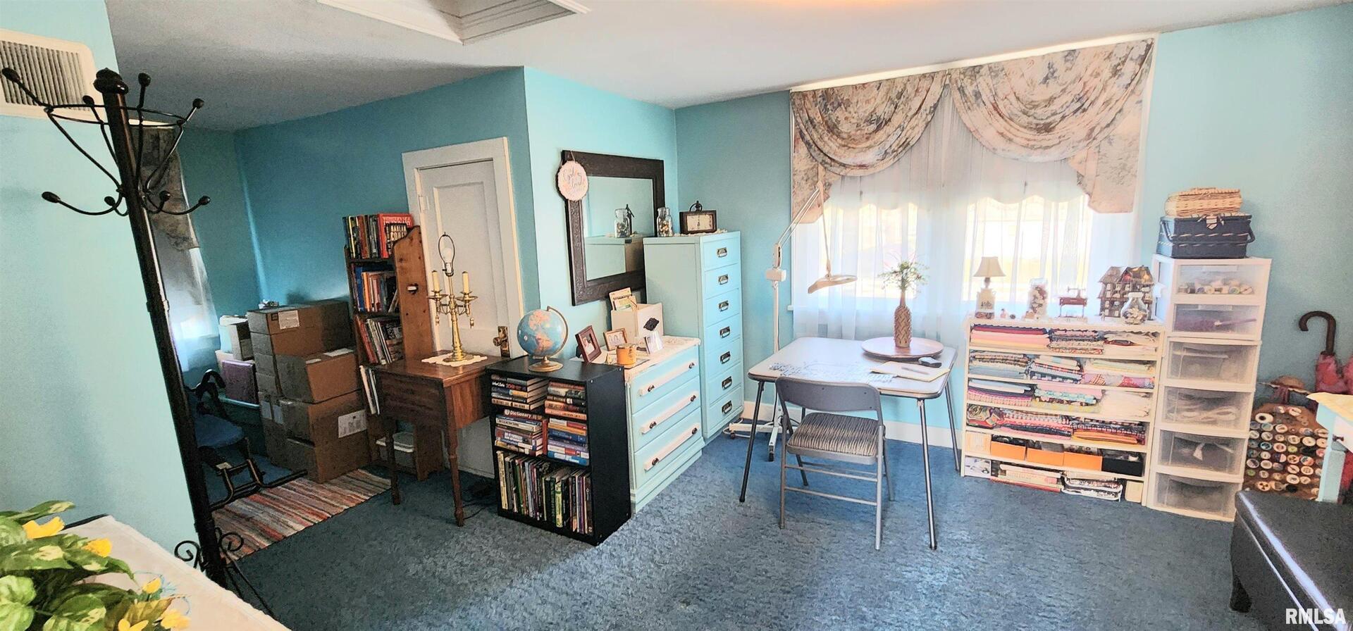 2412 State Street Chester, IL 62233 - Photo 9 of 11 a room with lots of wooden furniture and a window