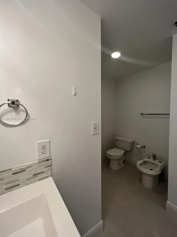 a bathroom with a sink and a toilet