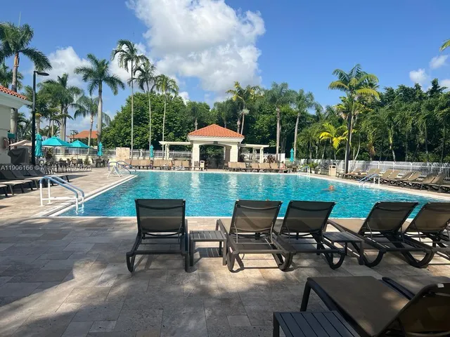 a view of a patio with a table and chairs