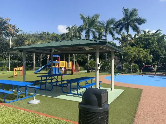 a view of a swimming pool with chairs