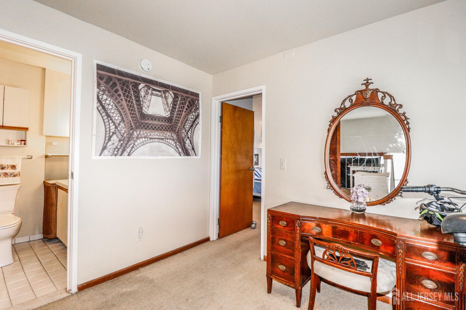 40 Fayette Street, Unit 57 Perth Amboy, NJ 08861 - Photo 17 of 33 a view of a livingroom with furniture and a mirror