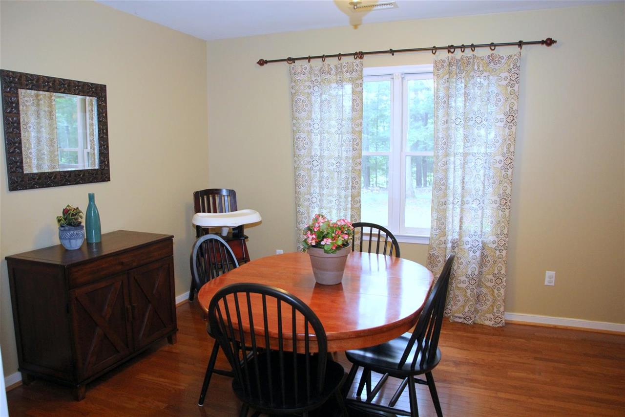 39 Rudolph Street Ruckersville, VA 22968 - Photo 12 of 30 a dining room with furniture and wooden floor