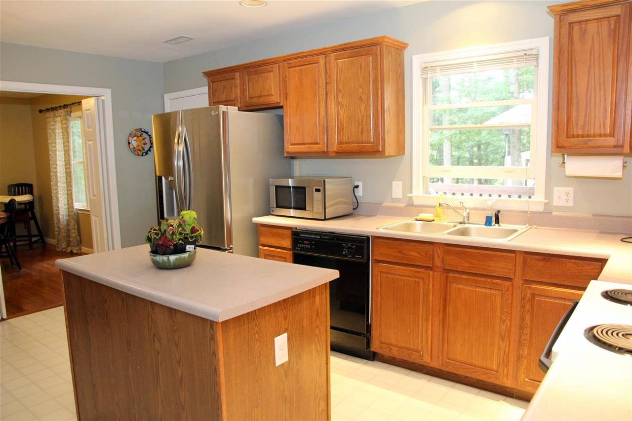 39 Rudolph Street Ruckersville, VA 22968 - Photo 14 of 30 a kitchen with stainless steel appliances granite countertop a sink stove and refrigerator