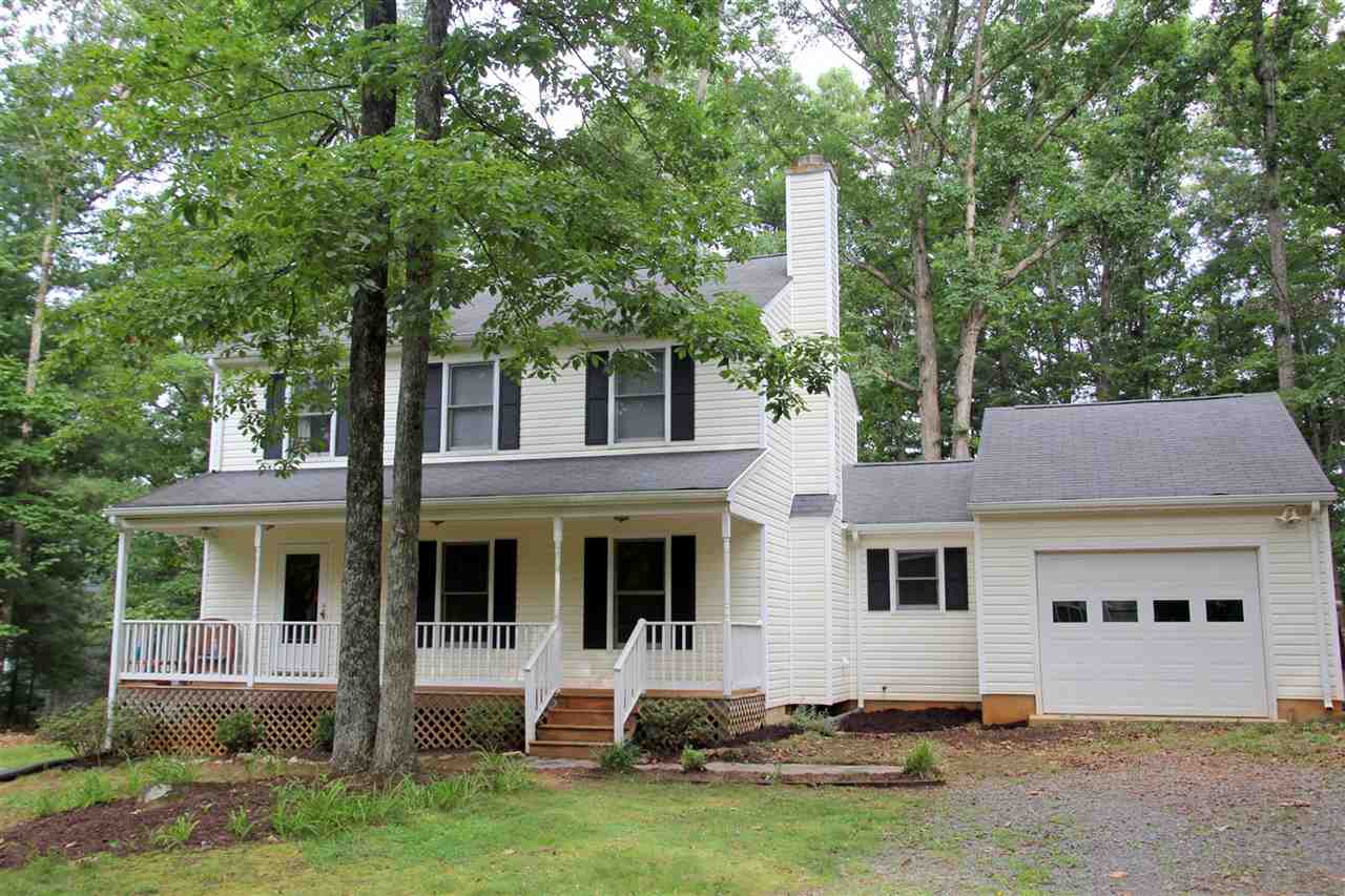 39 Rudolph Street Ruckersville, VA 22968 - Photo 2 of 30 a front view of a house with a yard and garage