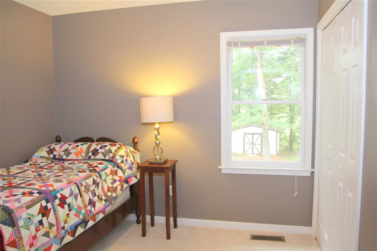 39 Rudolph Street Ruckersville, VA 22968 - Photo 22 of 30 a bedroom with a bed and a lamp next to a window