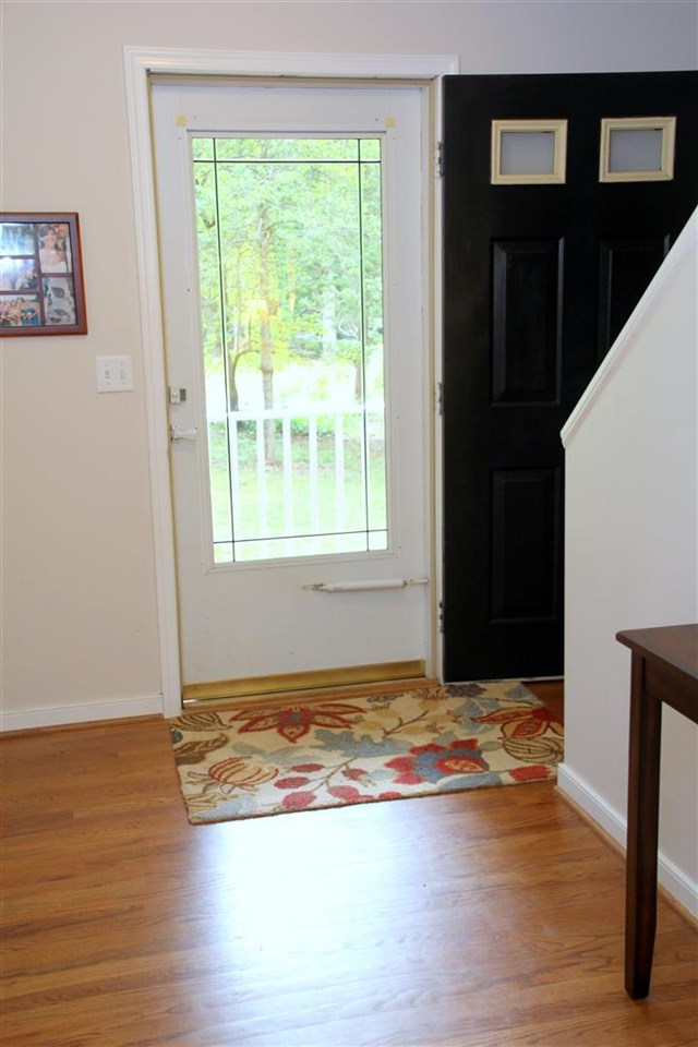 39 Rudolph Street Ruckersville, VA 22968 - Photo 7 of 30 a view of an empty room with wooden floor and a window