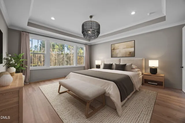 a bathroom with a granite countertop double vanity sink and mirror