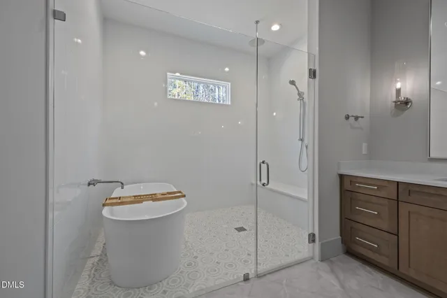 a bathroom with a granite countertop toilet sink and shower