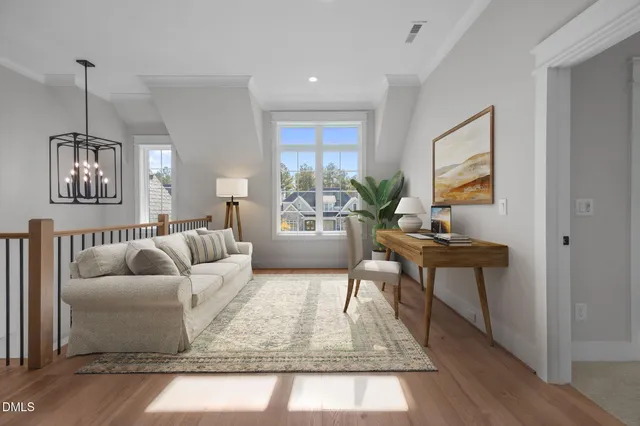 en empty room with windows and ceiling fan