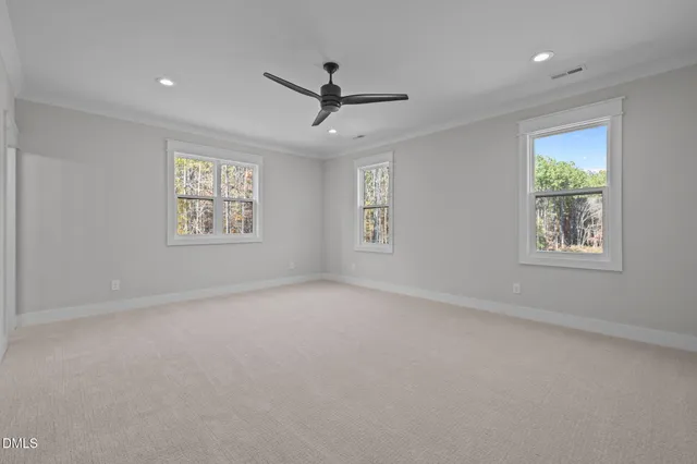 a view of a chairs and table in the backyard