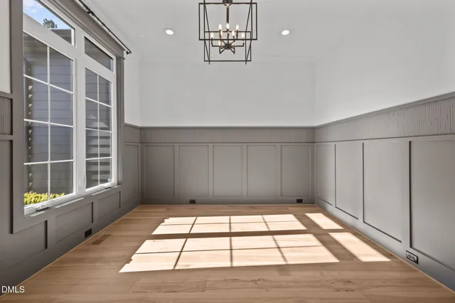 a kitchen with kitchen island a sink stainless steel appliances and cabinets