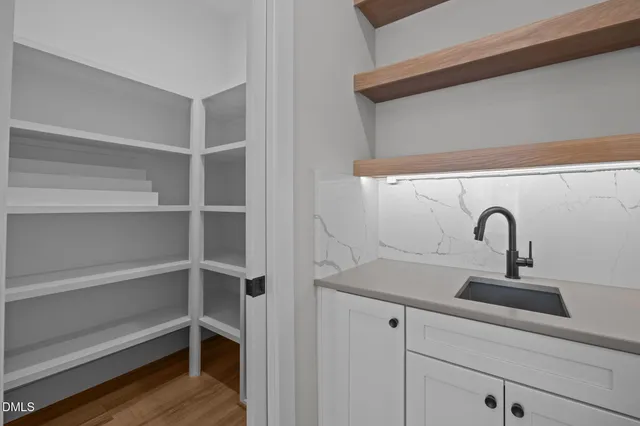 a living room with furniture wooden floor and a flat screen tv