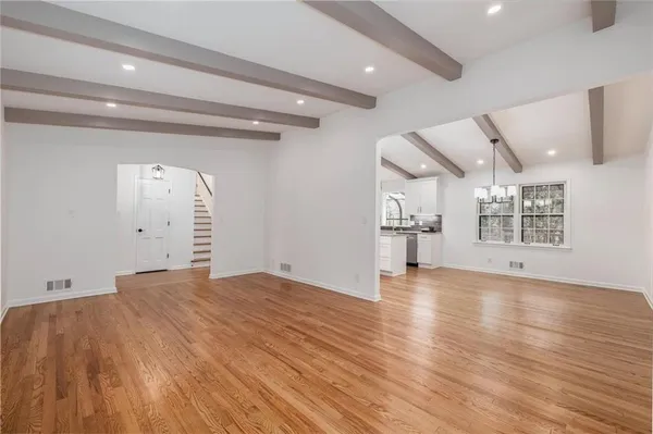 a view of living room with furniture and fireplace