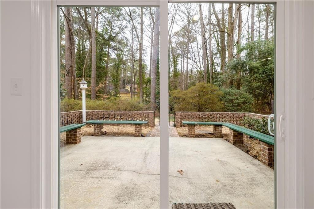 5087 Antelope Lane Smoke Rise, GA 30087 - Photo 24 of 56 view of living room with a large window and pool