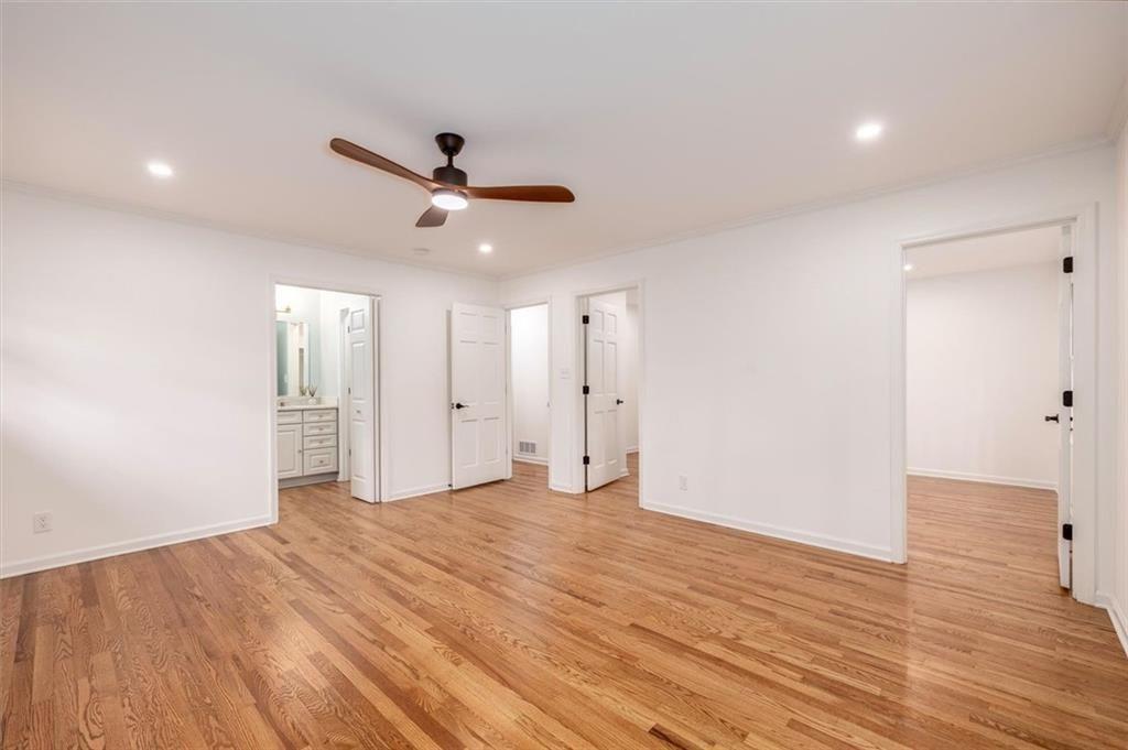 5087 Antelope Lane Smoke Rise, GA 30087 - Photo 34 of 56 an empty room with wooden floor and windows