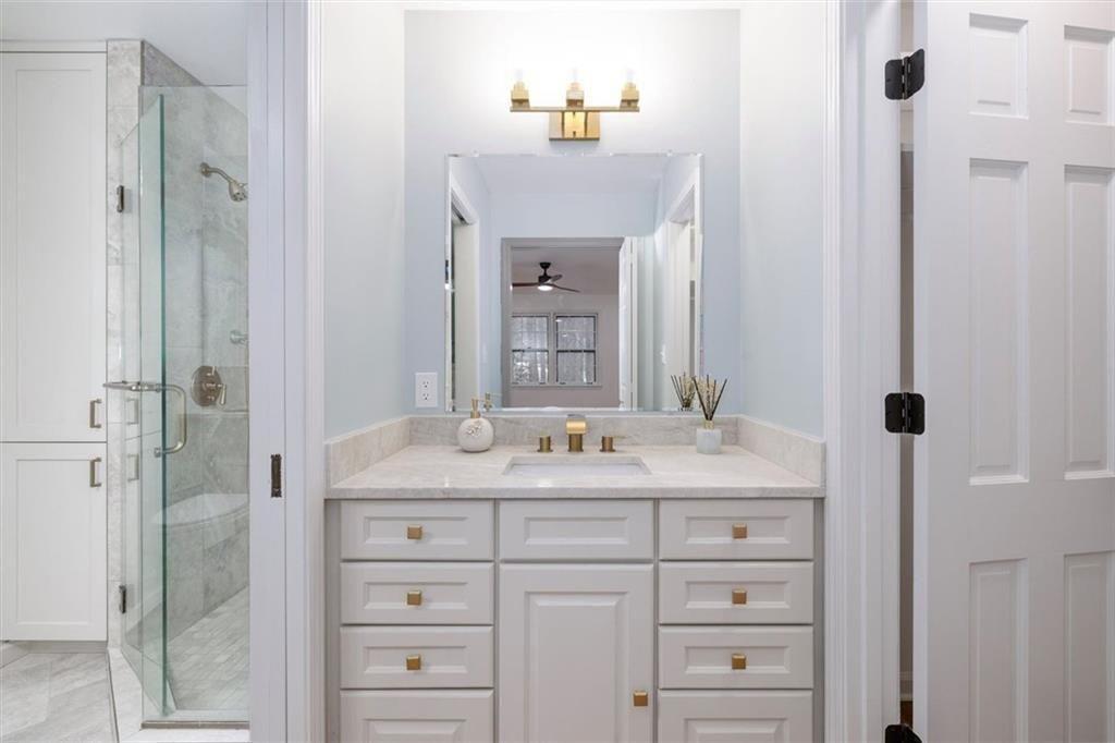 5087 Antelope Lane Smoke Rise, GA 30087 - Photo 37 of 56 a bathroom with a sink and a mirror