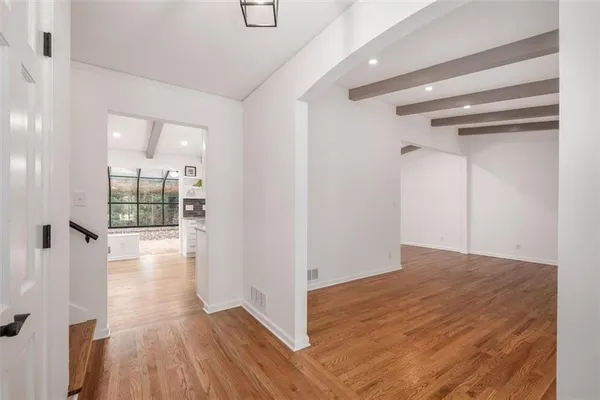 a kitchen with granite countertop a stove and a sink
