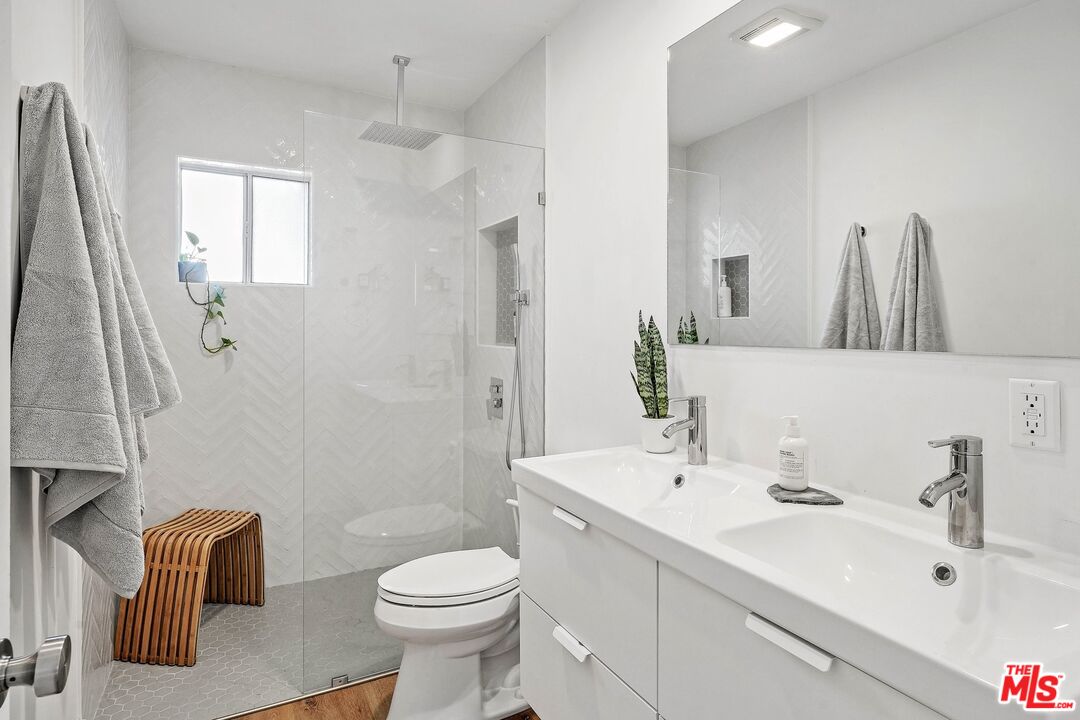 6926 Cedros Avenue Van Nuys, CA 91405 - Photo 15 of 26 a bathroom with a sink a toilet and shower