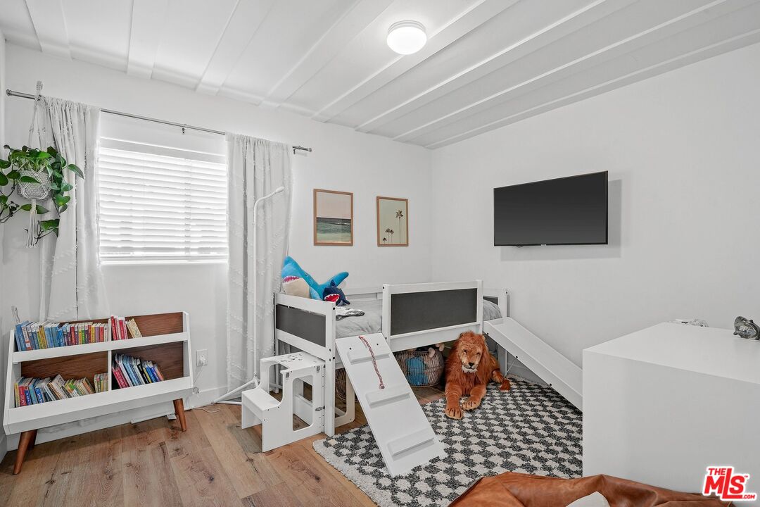 6926 Cedros Avenue Van Nuys, CA 91405 - Photo 16 of 26 a living room with furniture and a flat screen tv