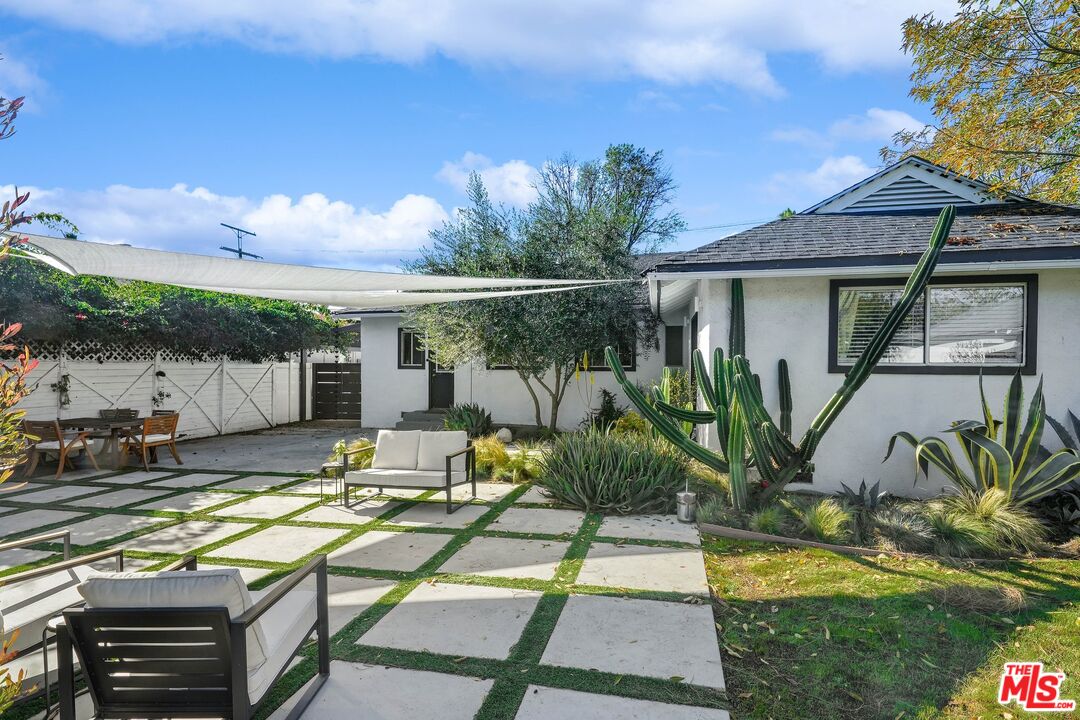6926 Cedros Avenue Van Nuys, CA 91405 - Photo 19 of 26 a view of a swimming pool with a patio