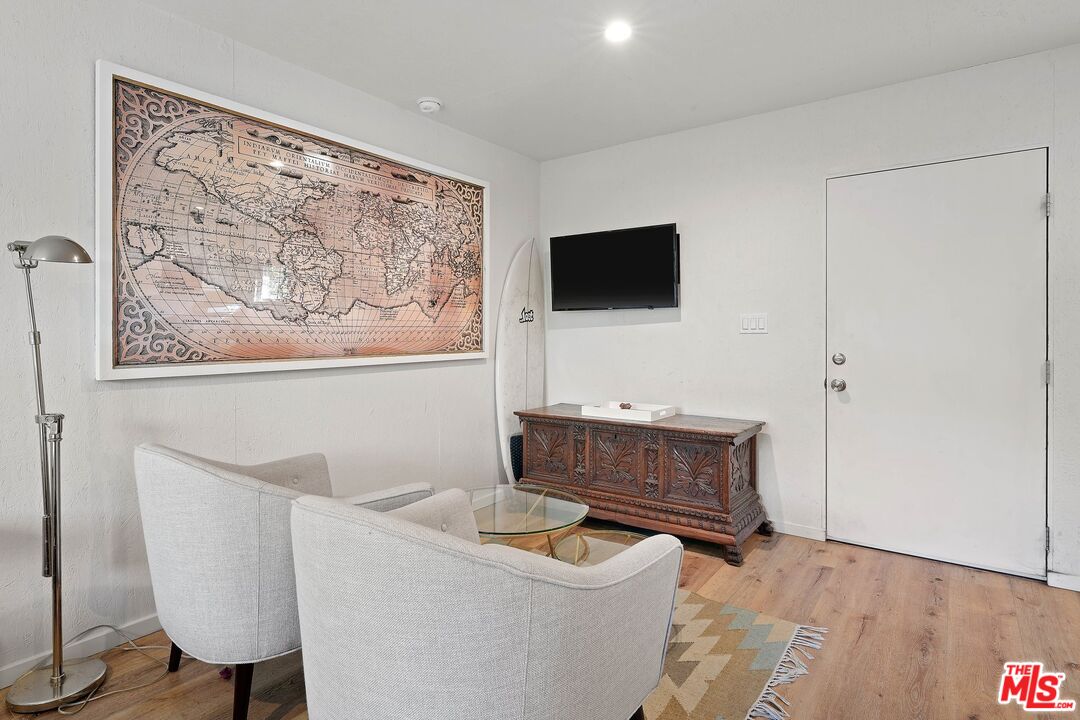 6926 Cedros Avenue Van Nuys, CA 91405 - Photo 23 of 26 a living room with furniture and a flat screen tv