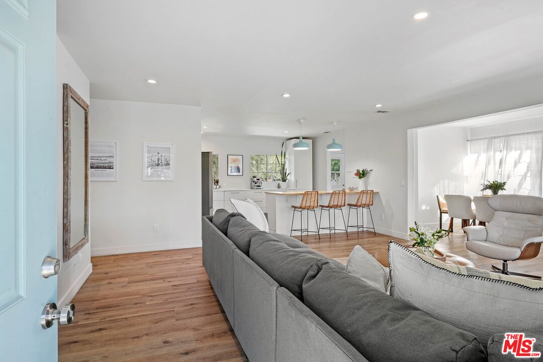 6926 Cedros Avenue Van Nuys, CA 91405 - Photo 4 of 26 a living room with furniture or couch and a wooden floor