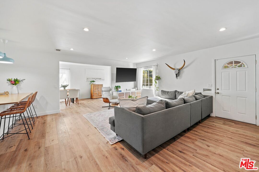 6926 Cedros Avenue Van Nuys, CA 91405 - Photo 6 of 26 a living room with furniture and a flat screen tv