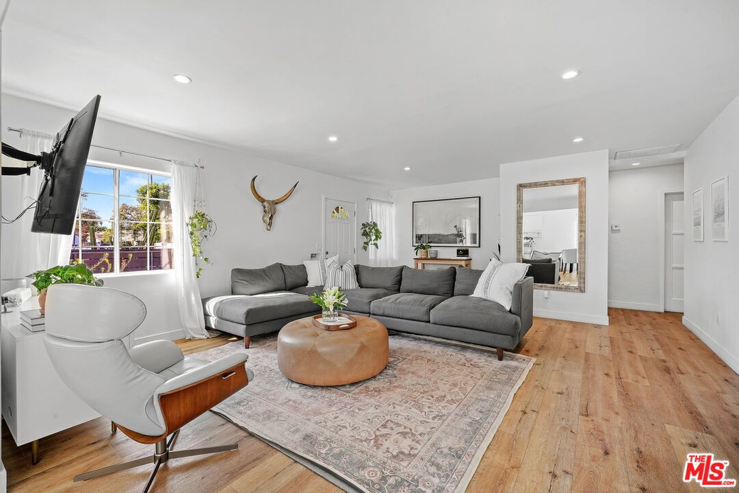 6926 Cedros Avenue Van Nuys, CA 91405 - Photo 8 of 26 a living room with furniture rug and window