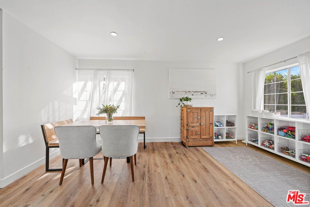 6926 Cedros Avenue Van Nuys, CA 91405 - Photo 9 of 26 a view of a dining room with furniture window and wooden floor