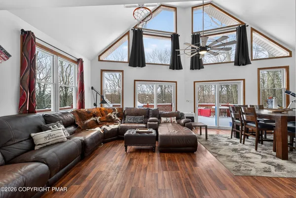 a living room with furniture or couch and a dining table