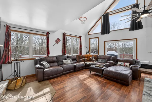 a living room with furniture and a large window
