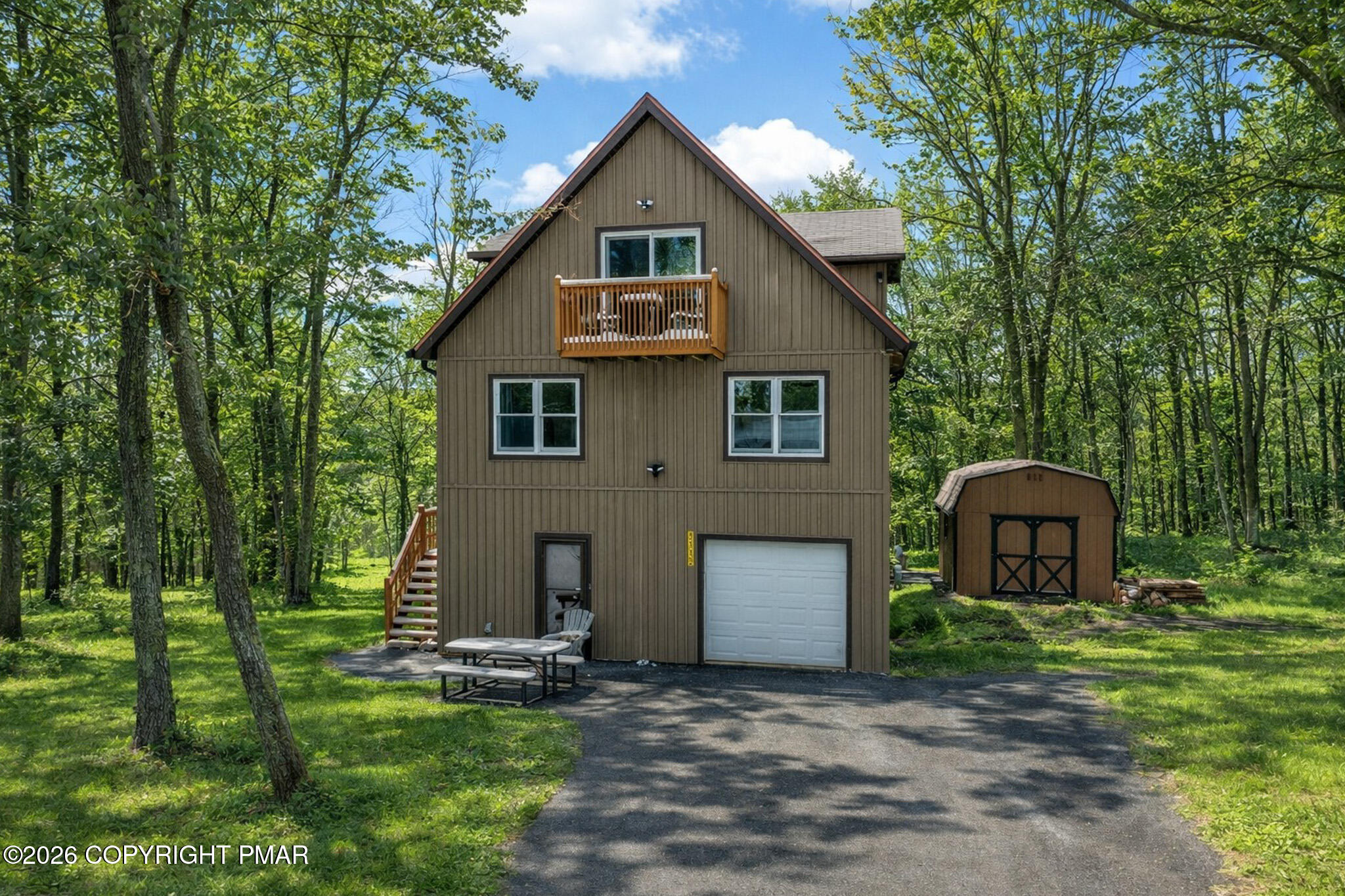 3112 Spring Court Bushkill, PA 18324 - Photo 2 of 52 a front view of a house with a garden and yard