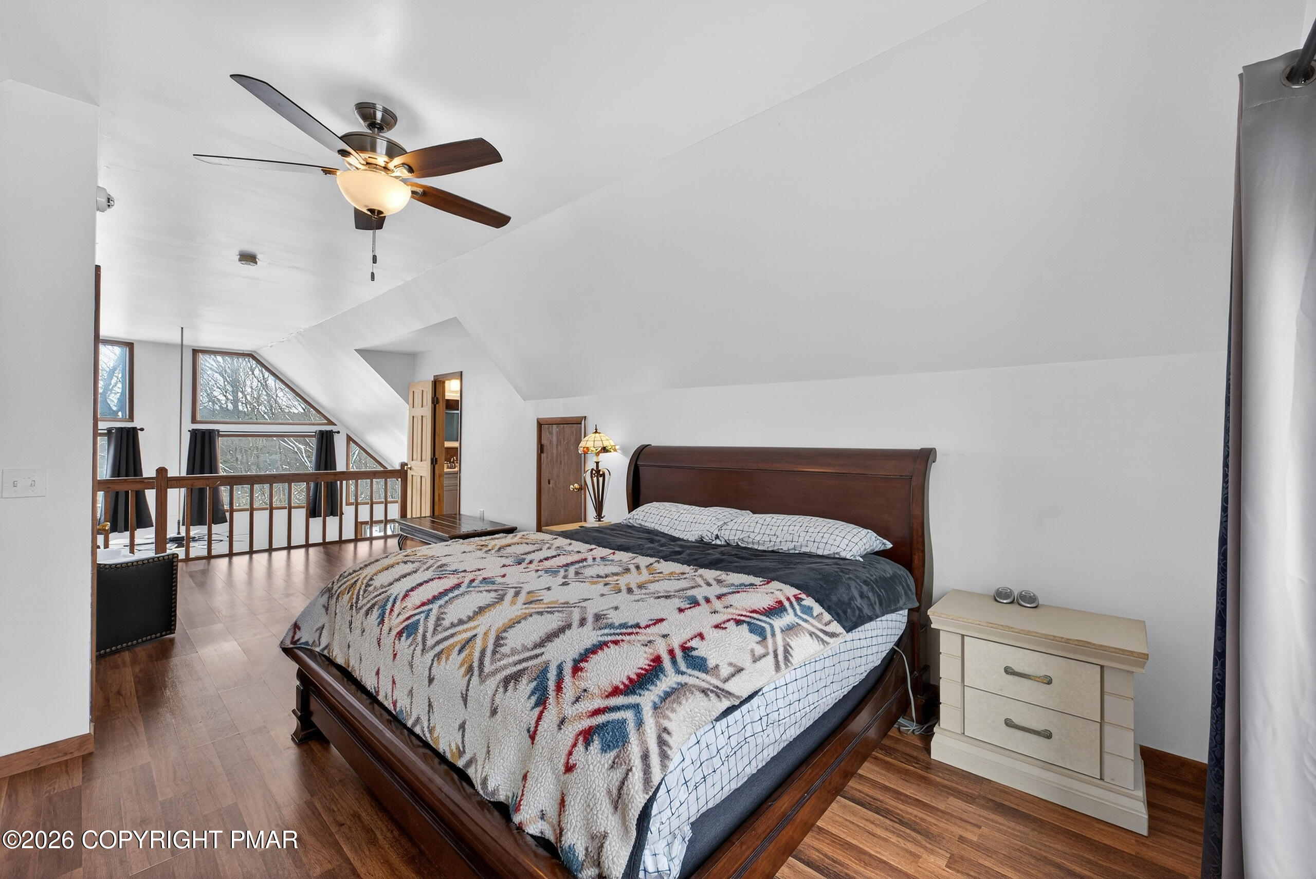 3112 Spring Court Bushkill, PA 18324 - Photo 33 of 52 a bedroom with a bed and a chandelier