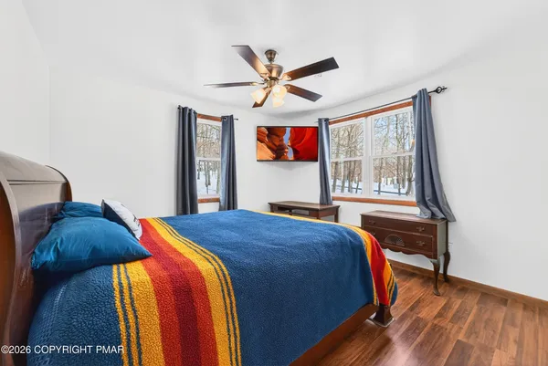 a bedroom with a bed and a book shelf