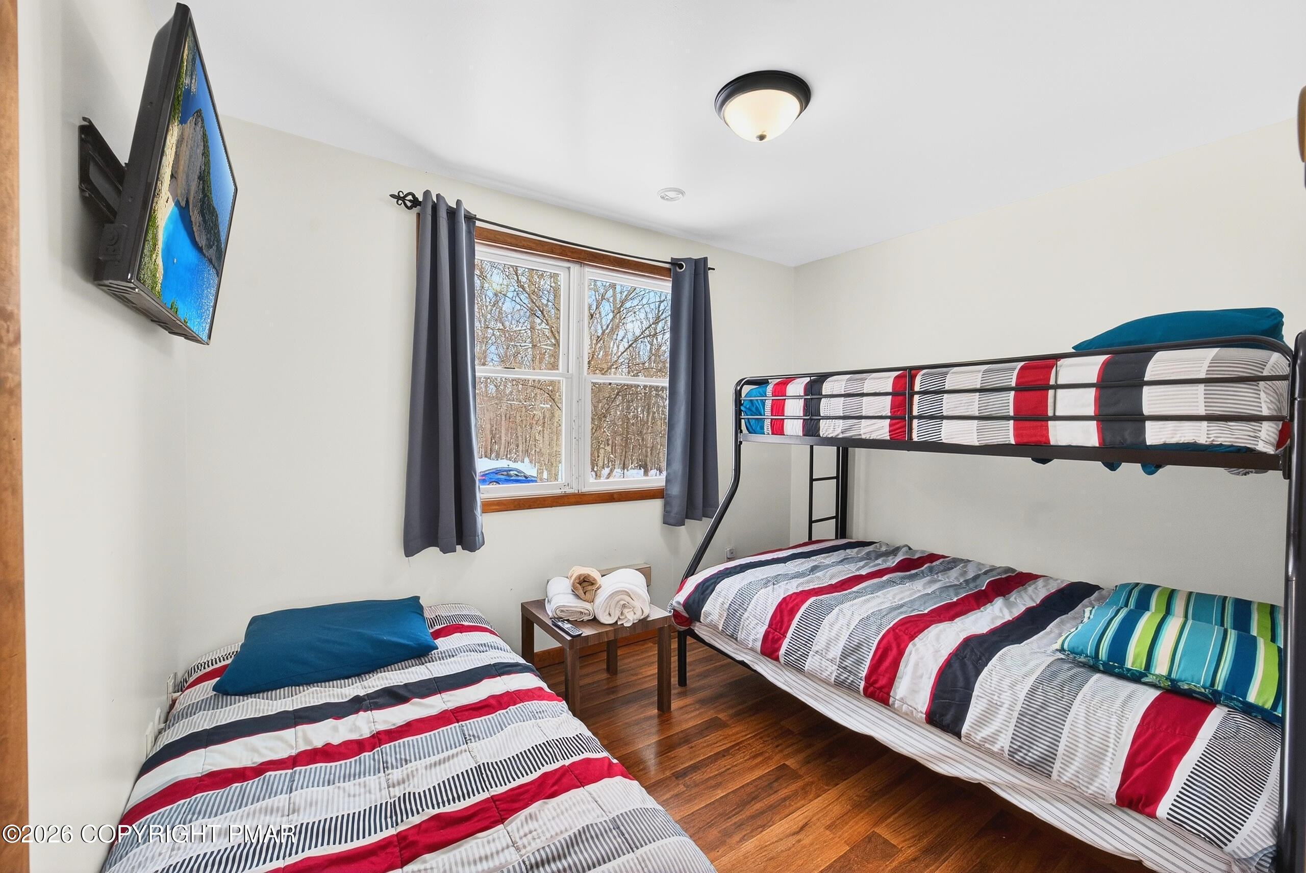 3112 Spring Court Bushkill, PA 18324 - Photo 42 of 52 a bedroom with a bed and a book shelf