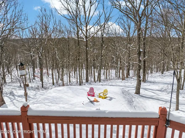 a view of wooden floor and a covered with snow