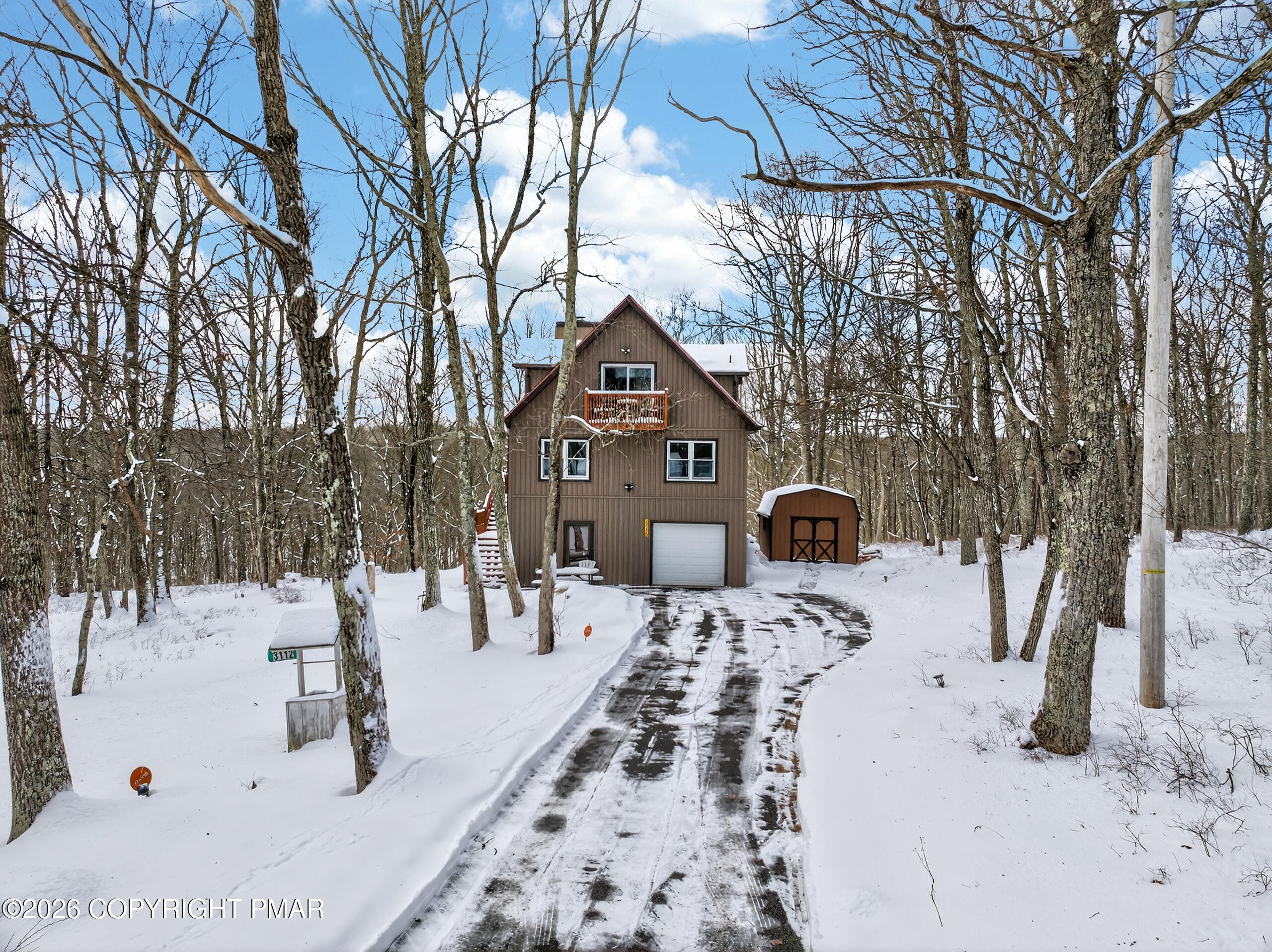 3112 Spring Court Bushkill, PA 18324 - Photo 8 of 52 a front view of a house with a yard covered in snow