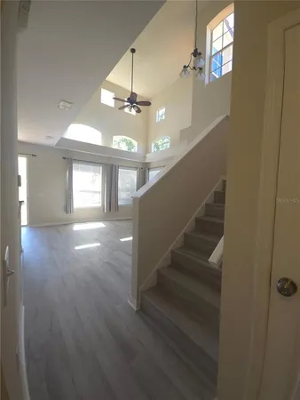 a view of entryway and hall with wooden floor