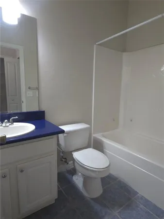 a bathroom with a sink a toilet and a bathtub