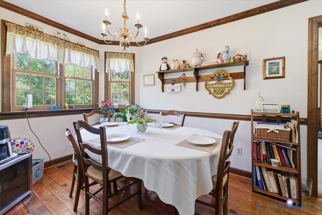 15414 Sunnybrook Road Petersburg, VA 23805 - Photo 13 of 29 a view of a dining room with furniture window and wooden floor