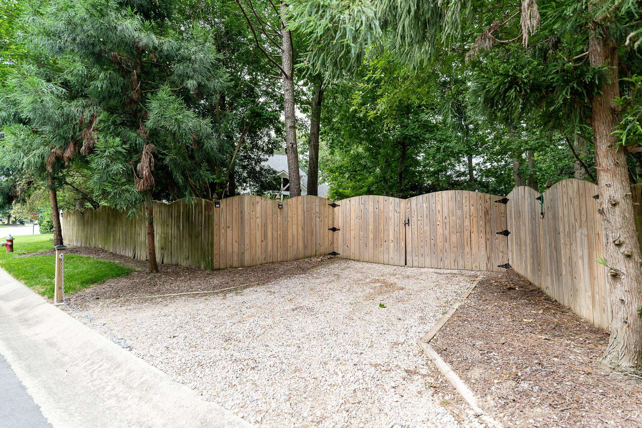 3413 Dewing Drive Raleigh, NC 27616 - Photo 71 of 82 Double gate gives direct access to backyard from the road to allow for pulling in a vehicle Side gate