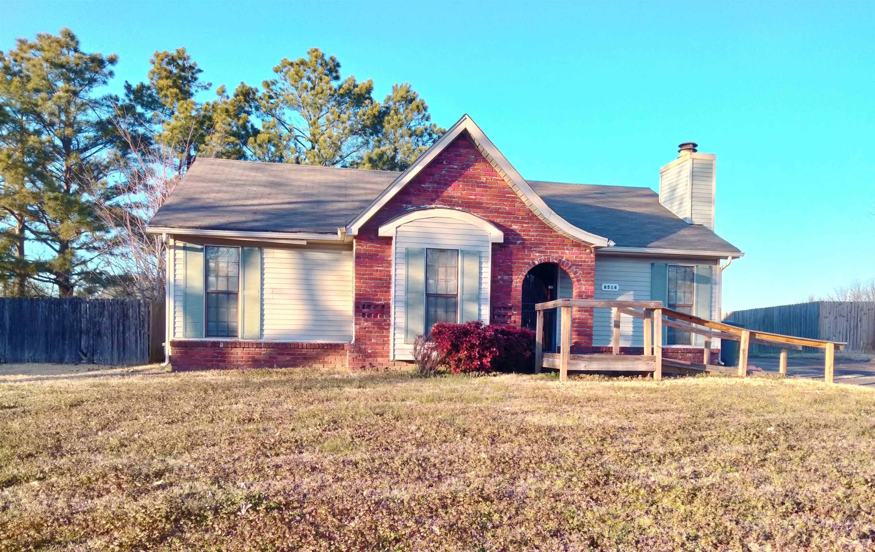 6514 Falling Mist Lane Memphis, TN 38141 - Photo 1 of 21 a front view of a house with garden