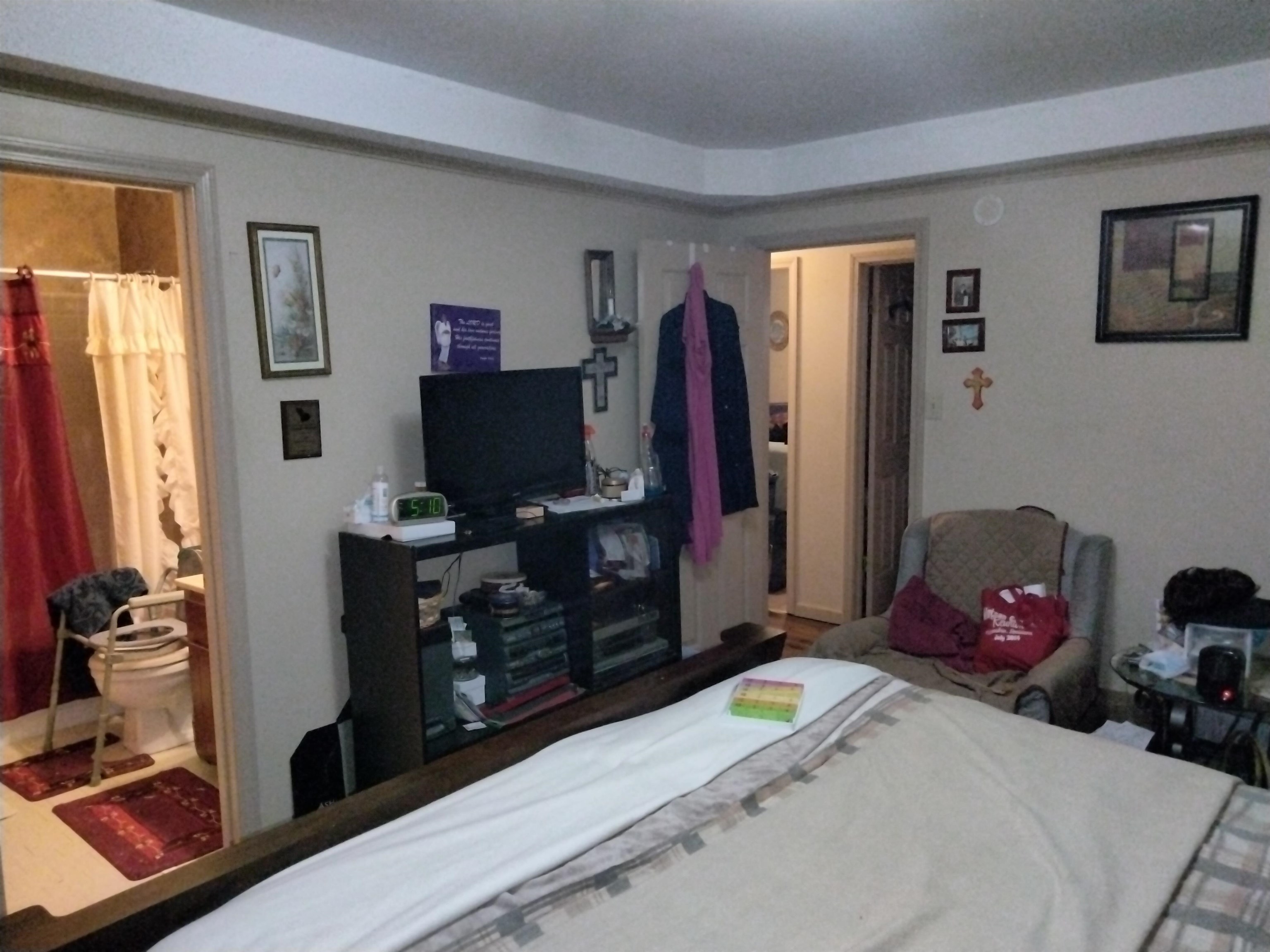 6514 Falling Mist Lane Memphis, TN 38141 - Photo 13 of 21 a bedroom with a bed and a flat tv screen on dresser