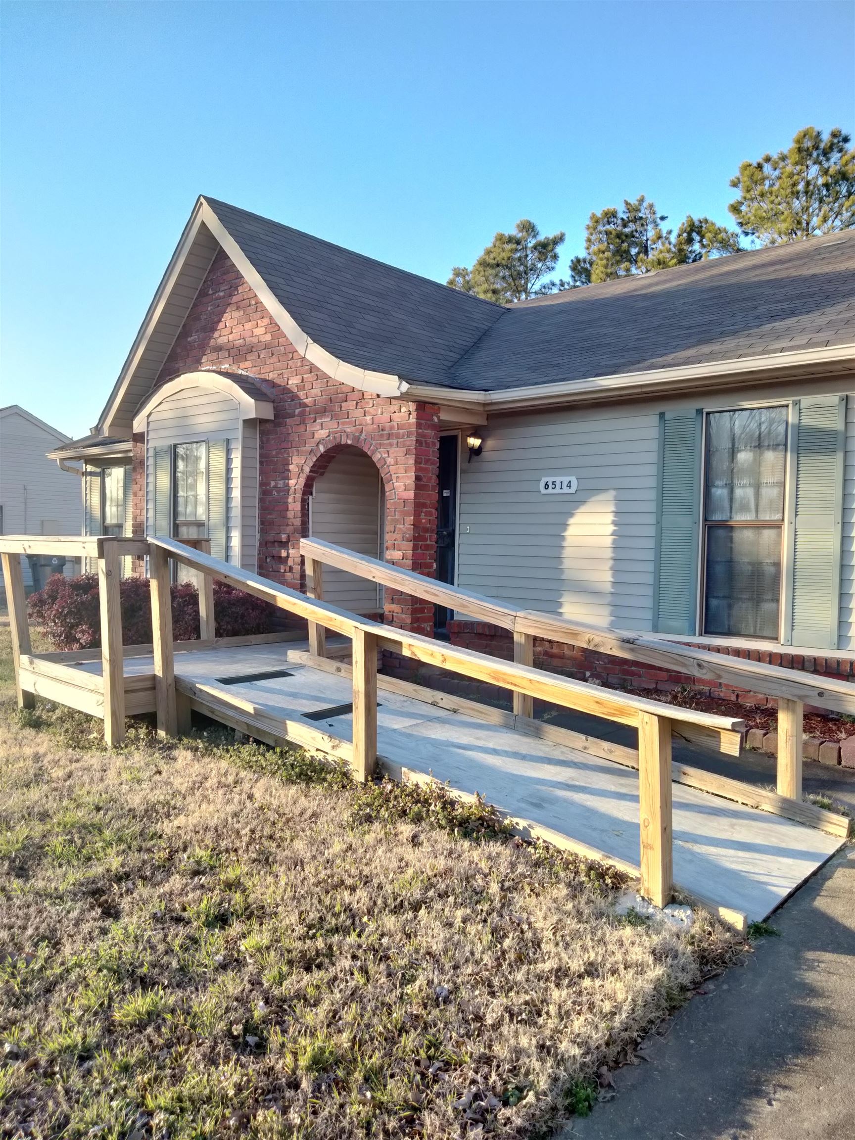 6514 Falling Mist Lane Memphis, TN 38141 - Photo 2 of 21 a view of a house with a wooden fence