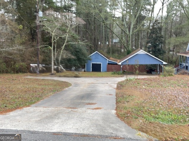 3055 Spot Road Cumming, GA 30040 - Photo 5 of 6 a view of house with yard and sitting area