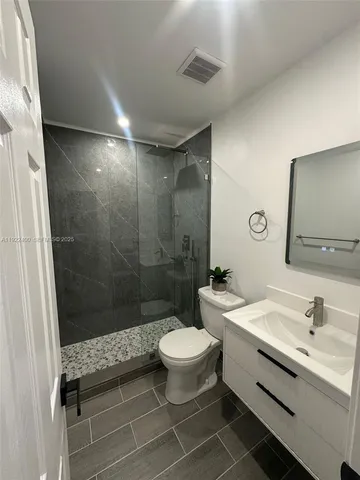 a view of an empty room with windows