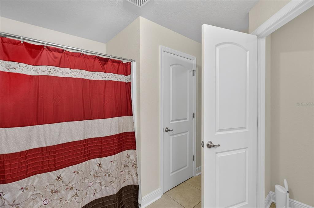 8049 Dimstead Street Port Charlotte, FL 33981 - Photo 22 of 39 a view of a room with wooden floor and a cabinet