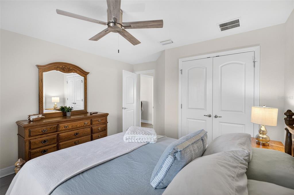 8049 Dimstead Street Port Charlotte, FL 33981 - Photo 25 of 39 a bedroom with a bed and a dresser