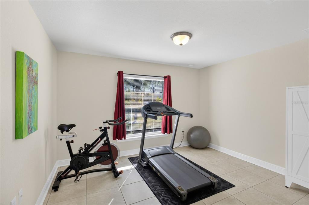 8049 Dimstead Street Port Charlotte, FL 33981 - Photo 29 of 39 a room with gym equipment and a window