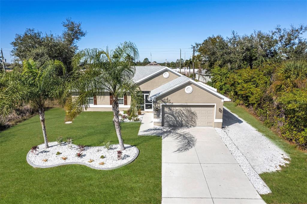8049 Dimstead Street Port Charlotte, FL 33981 - Photo 33 of 39 a view of a chair and table in backyard of the house